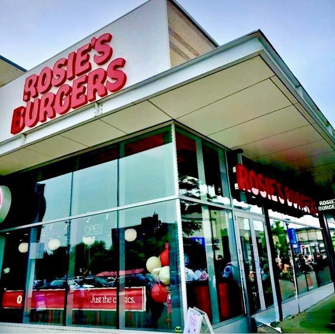 A restaurant with glass windows  AI-generated content may be incorrect.