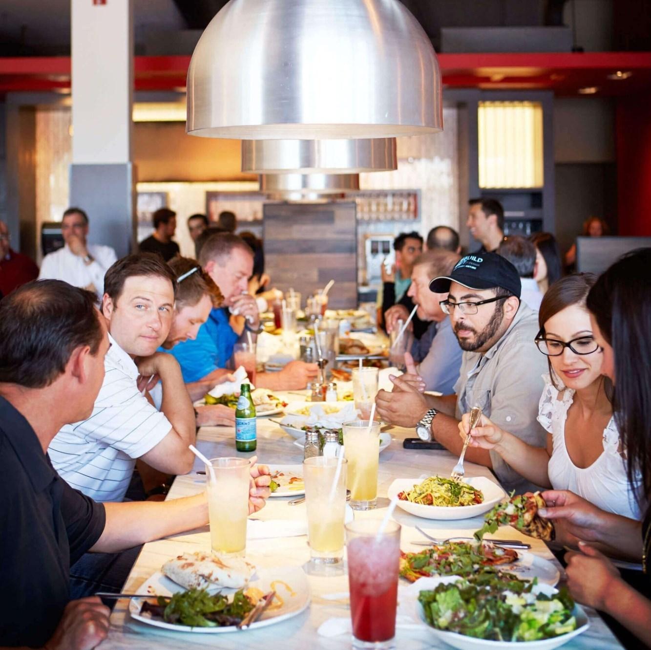 A group of people eating at a restaurant

AI-generated content may be incorrect.